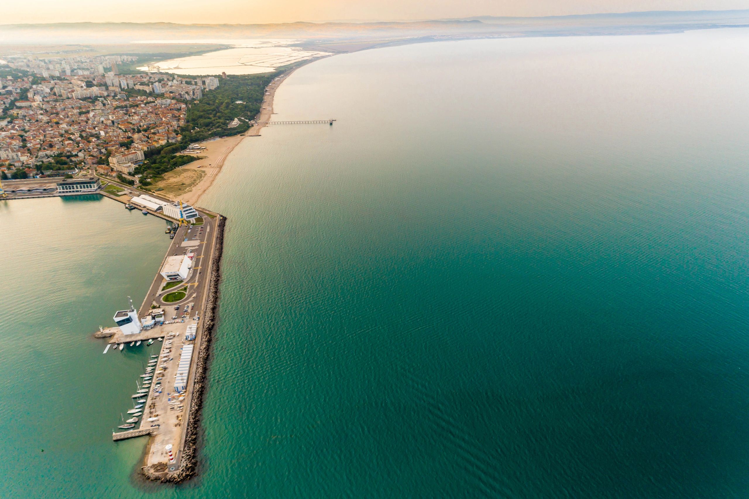 Aerial view of a coastal port city and harbor